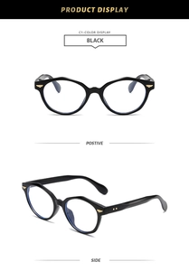 Detail view of black polygon anti-blue light glasses with golden wing temple accents