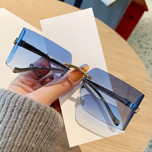 Frameless blue gradient sunglasses with gold metal leopard head details for trendy outfits