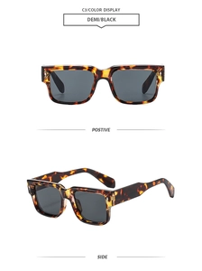Detail of tortoise shell square frame sunglasses with metal rivets and dark lenses