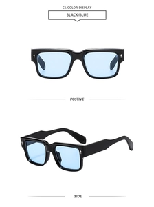 Detail view of black square frame sunglasses with blue lenses and silver rivets
