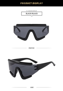 Front and side views of black oversized cyberpunk wrap-around sunglasses with wave frame