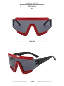Front and side views of oversized shield sunglasses with red and black bold outlines