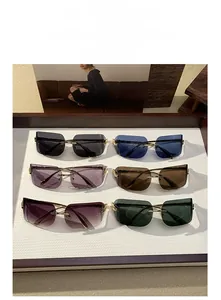 Collection of rimless oversized sunglasses in various colors with gold metal temples