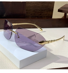 Detail view of purple gradient rimless lenses with elegant gold metallic temples