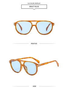 Detail view of tortoiseshell aviator sunglasses with light blue lenses and metal hinges