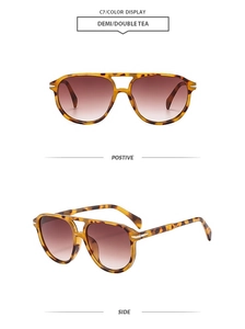 Detail of tortoise frame aviator sunglasses with brown gradient lenses and silver accents