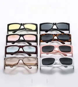 Flat lay of stylish rectangular sunglasses in multiple colors for trendy streetwear outfits