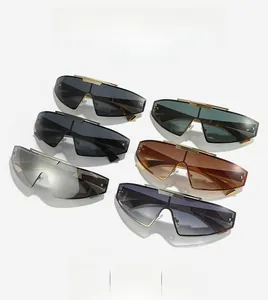 Flat lay of futuristic rimless shield sunglasses in multiple colors with metallic top bars
