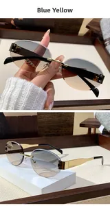 Detail of rimless oval sunglasses with blue-yellow gradient lenses and golden metal temples