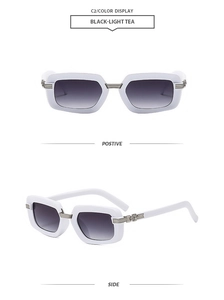 Macro detail of white square sunglasses with silver cross emblem and gradient lenses