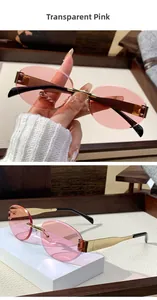 Detail of rimless oval sunglasses featuring transparent pink lenses and gold metal frame