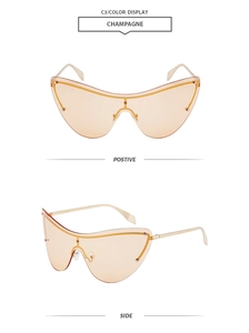 Detail view of champagne rimless sunglasses with gold metal temples and rivet accents