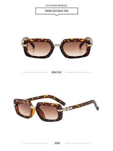 Detail view of demi square sunglasses with brown gradient lenses and gold accents