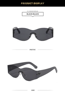 Detail of futuristic rimless wrap sunglasses in black with Y2K sporty style and rivets