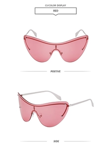 Close-up of pink frameless shield sunglasses with silver metal temples and rivets