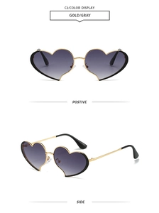 Vue détaillée des lunettes de soleil en cœur avec monture dorée et verres dégradés