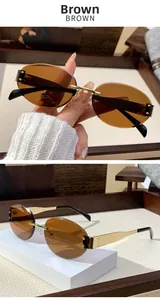 Detail view of rimless brown oval sunglasses with gold metal temples and black earpieces