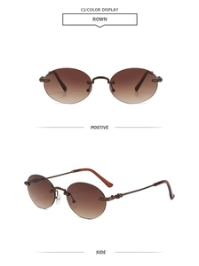 Détail de lunettes de soleil rondes sans monture avec verres dégradés et gravures rétro