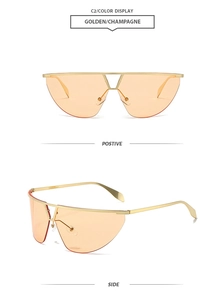 Detail of golden metal double bridge sunglasses with champagne semi-rimless lenses