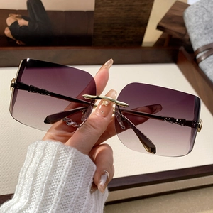 Fashionable rimless square oversized sunglasses with purple gradient lenses and gold metal temples