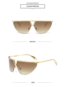 Detail of golden metal semi-rimless frame and brown gradient lenses on future style sunglasses