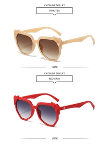 Detail view of geometric frames with silver wing metal hinges on stylish sunglasses