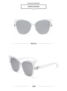 Front and side view of white butterfly sunglasses with rhinestones and silver lenses