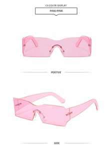 Close-up of pink rimless Y2K sunglasses with curved lenses and metal rivets