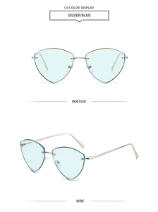 Detailed close-up of rimless geometric blue lens sunglasses with silver metal temples
