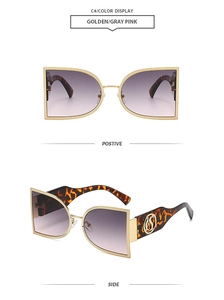 Macro detail of semi-circular metal frame sunglasses with tortoiseshell temples and S logo