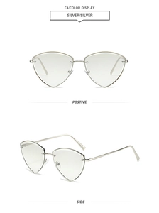 Detail view of silver geometric rimless sunglasses showing metal frame and side temple design