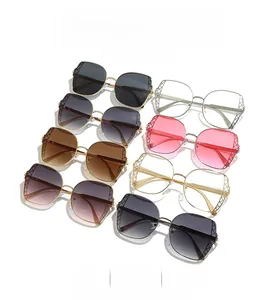 Detail of metal polygon sunglasses frames with textured diamond pattern on the side rims
