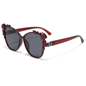 Fashionable oversized red translucent frame sunglasses with rhinestone accents and dark lenses