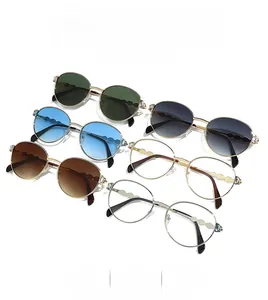 Classic round metal sunglasses in various colors featuring unique wavy temple design