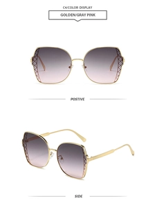 Detail of golden metal polygonal sunglasses with gray pink gradient lenses and mesh texture