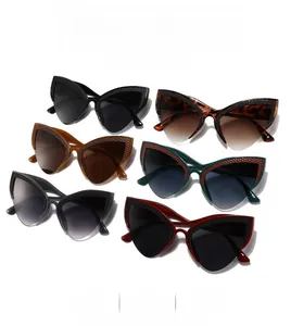Detail showing various colors and woven texture frames of the cat-eye sunglasses