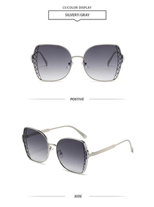 Detail view of silver polygonal sunglasses with gradient gray lenses and woven texture