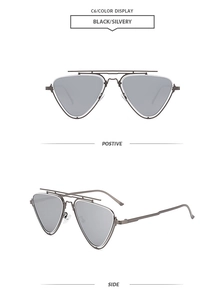 Detail of pilot-style sunglasses with triangular lenses in black and silver metal frames