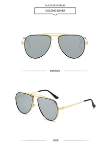 Detail view of gold metal double bridge aviator sunglasses with silver grey lenses