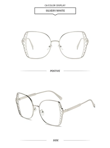 Detail view of silver polygonal metal frame sunglasses with hollow mesh craft on temples
