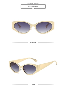 Detail view of oval sunglasses with golden wide frame and gray gradient lenses