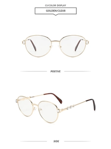 Detail view of gold metal oval frame glasses with sparkling crystal rhinestones