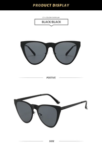 Detail view of classic black cat-eye sunglasses with reinforced hinges and ergonomic temples