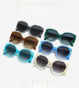 Flat lay of retro oversized polygon sunglasses in six different gradient colors