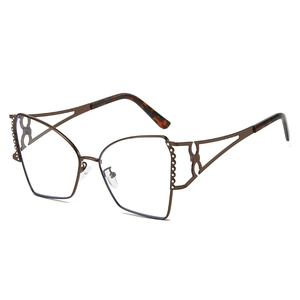 Occhiali da sole da donna cat-eye a poligono con strass e montatura in metallo cavo