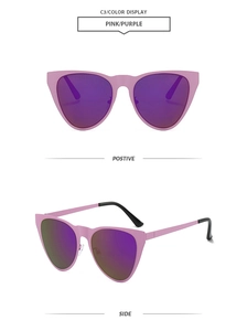Detail view of pink cat-eye sunglasses with purple reflective lenses and black temple tips