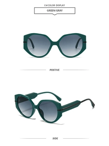 Detail view of emerald green oversized polygonal sunglasses with gray gradient lenses
