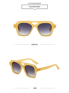 Detail view of yellow translucent square sunglasses with double bridge and gradient lenses