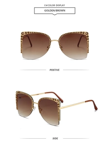 Details der Halbrand-Sonnenbrille mit braunen Kristallen und goldenen Gläsern
