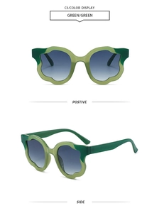 Detail view of wavy flower petal frame sunglasses in dual green with blue gradient lenses